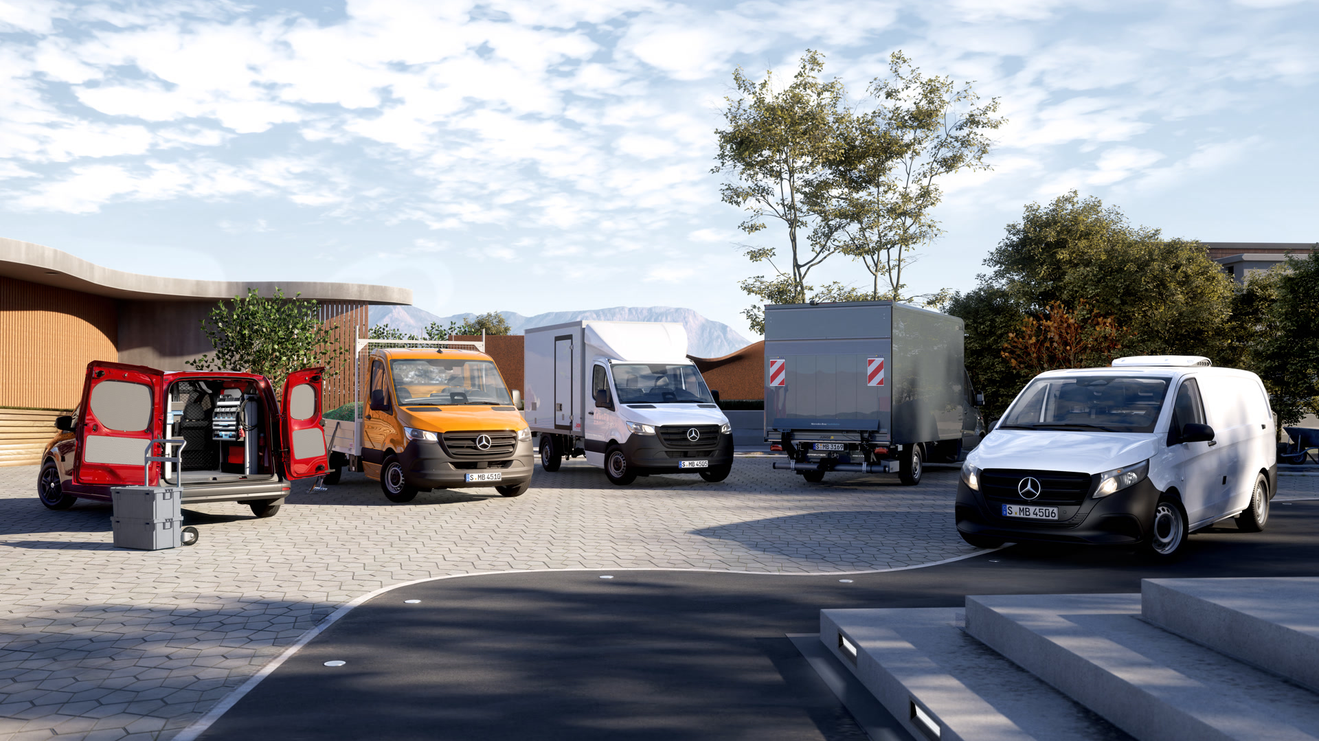 Mehrere Mercedes-Benz Transporter und Kastenwagen in verschiedenen Ausführungen stehen auf einem Hof vor modernen Gebäuden bei Tageslicht.