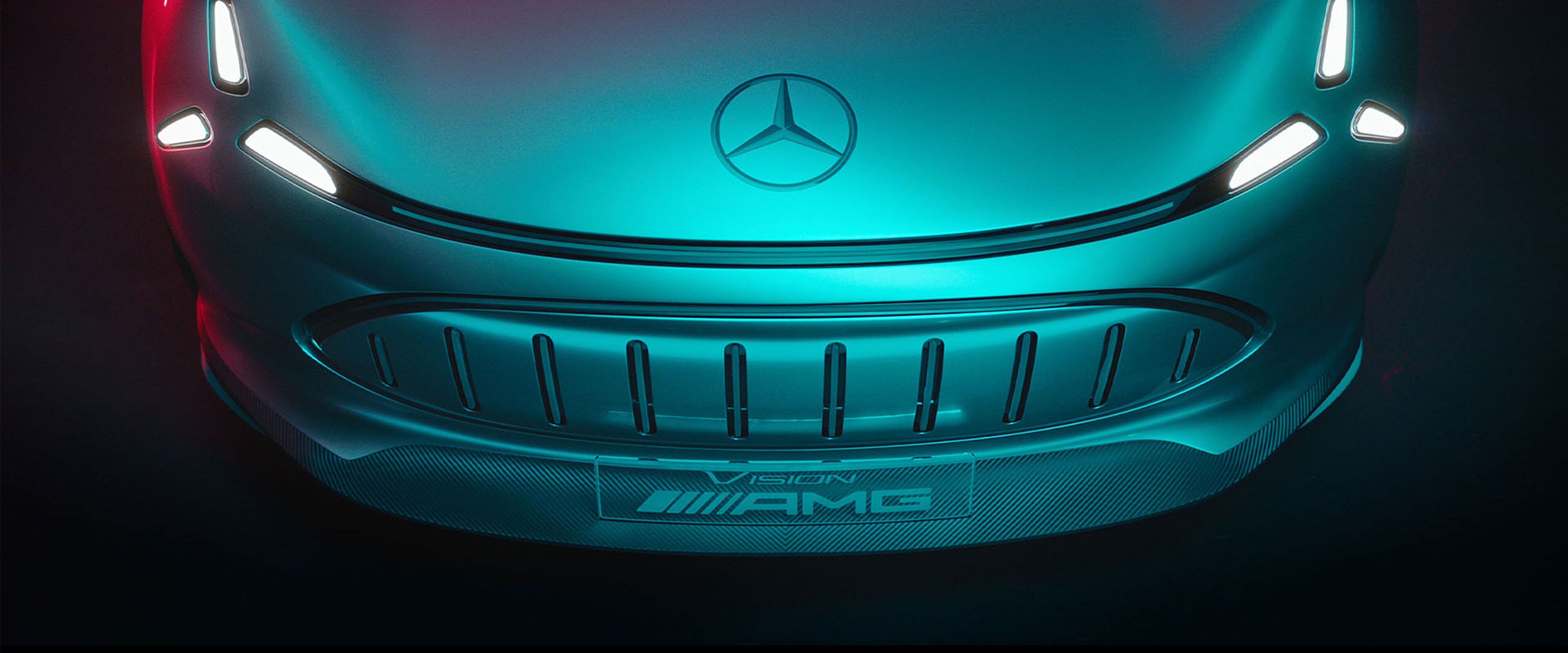 Eine Nahaufnahme der futuristischen Front eines eleganten Vision AMG Fahrzeugs.