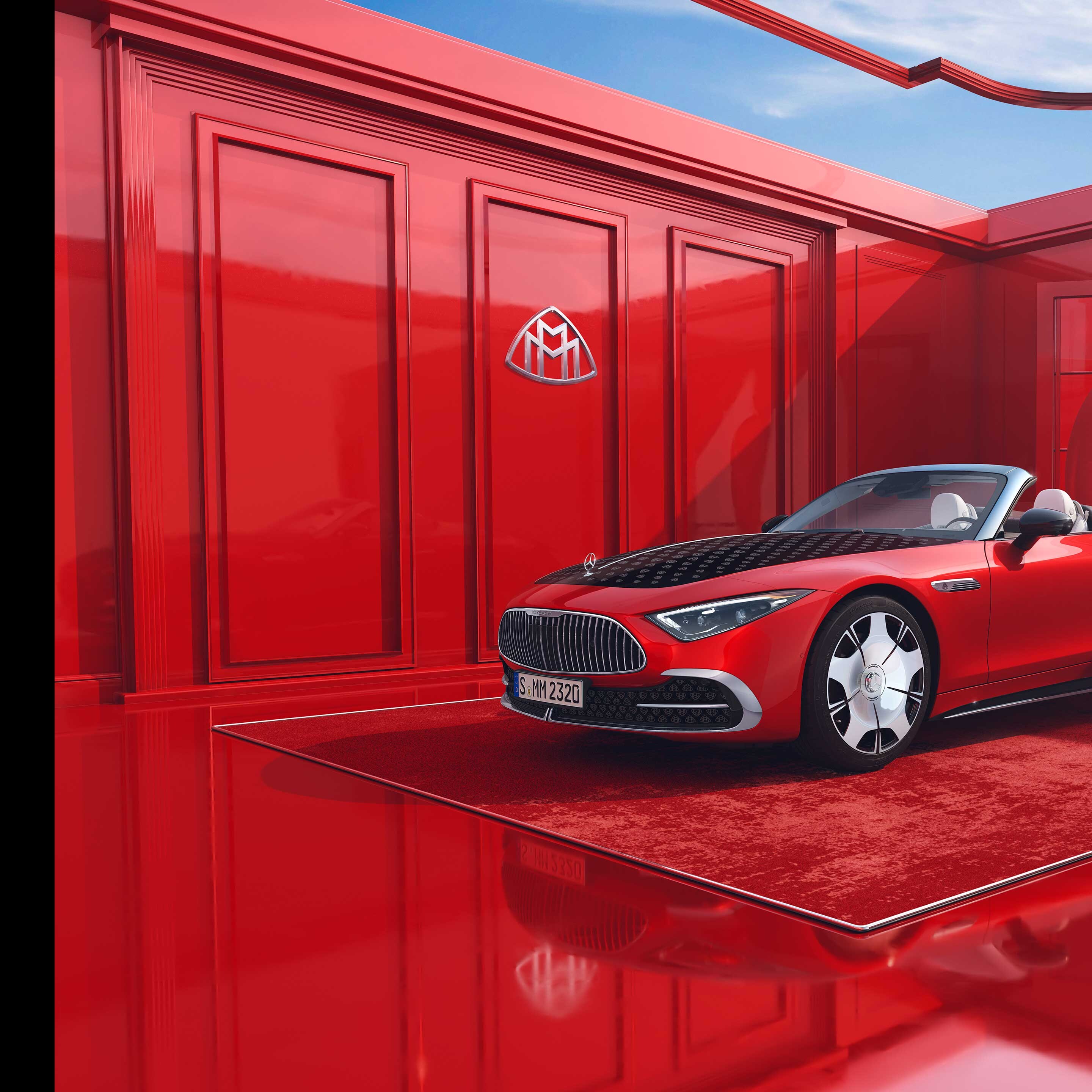 Seitenansicht eines roten Mercedes-Maybach SL 680 Monogram Series vor rotem Grund.