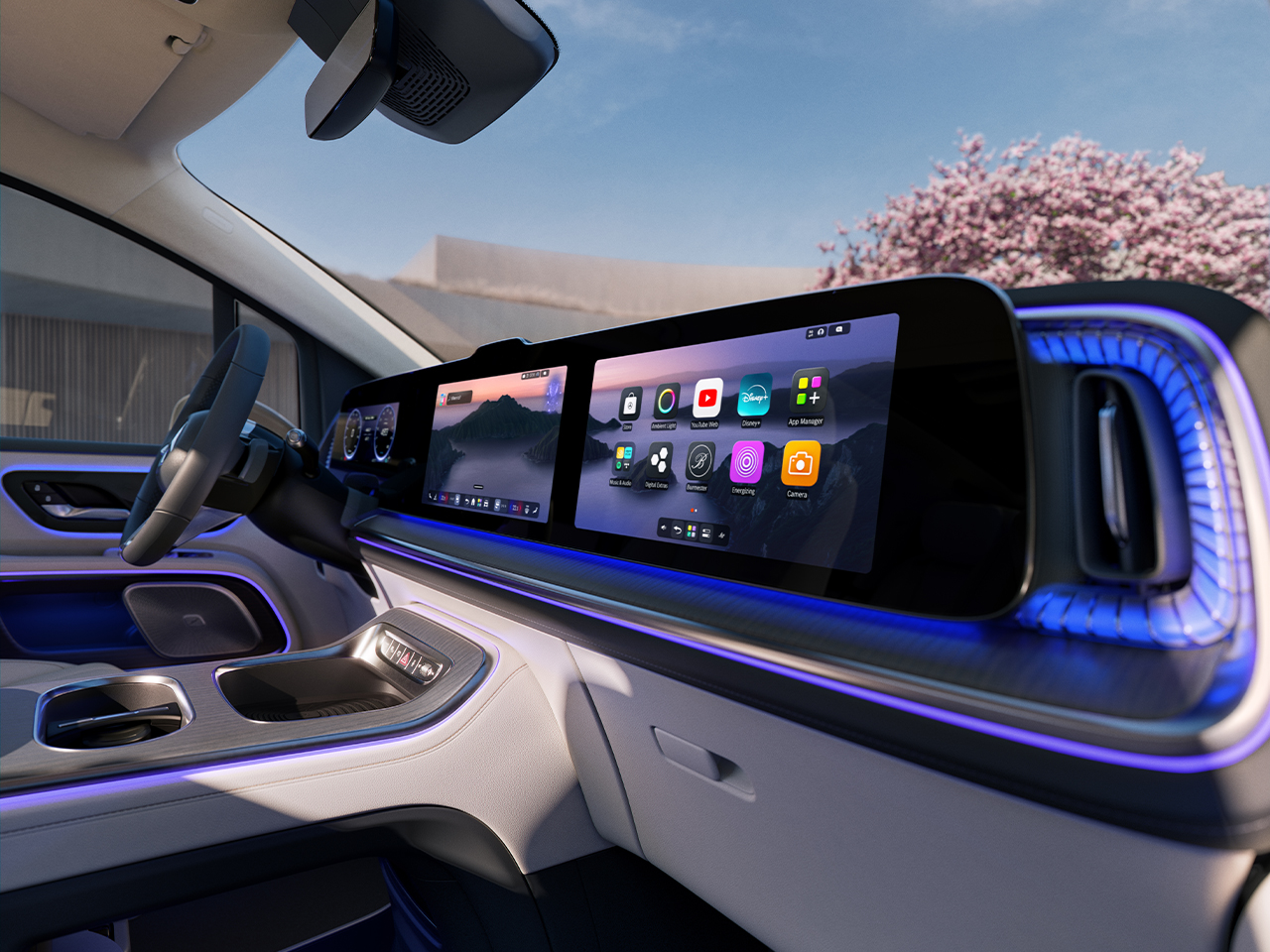 VLE | Mercedes-Benz Zu sehen ist das Interieur und das MBUX des VLEs. Im Hintergrund ist ein Kirschbaum zu sehen.