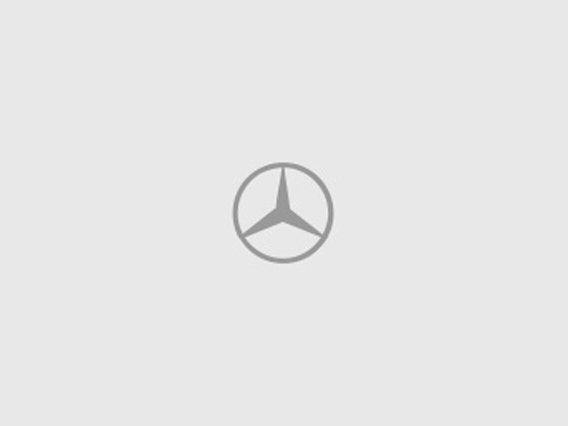Ein hellgrauer Hintergrund mit einem dunkelgrauen Mercedes-Benz Stern in der Mitte.